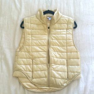 Sleeveless cream puffer vest